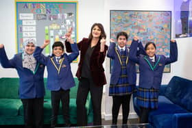 Carlton Junior and Infant School Headteacher Rizwana Ahmed with some of the school's pupils after the school was named among the top three in the country.