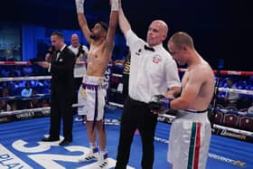 Amaar Akbar has his hands raised after a first round win over Georgi Velichkov.
