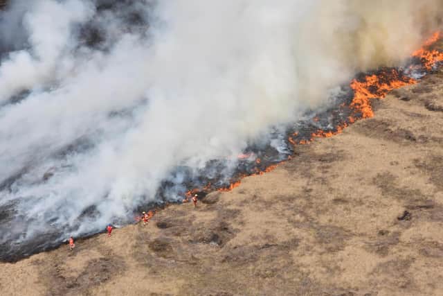 Meters of moorland went up in flames at two different sites in Marsden.