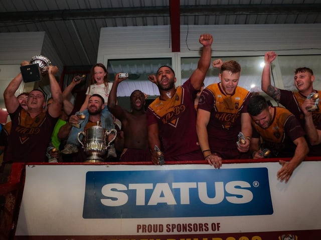 Dewsbury Moor Maroons' winning team celebrate after their Jim Brown Challenge Cup final success.