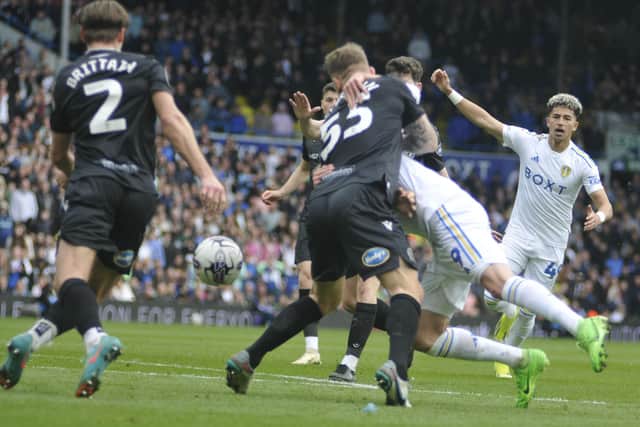 Patrick Bamford is wrestled to the ground but no penalty was forthcoming for Leeds United.