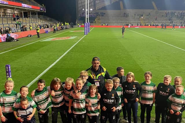 Dewsbury Celtic legend Danny Thomas with current juniors at Headingley for the World Cup match between Jamaica and Ireland.