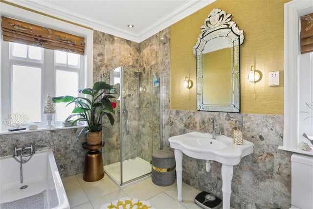 The house bathroom includes both bath and shower.