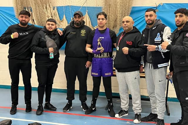 Winning boxing debutant Malaika Atique with the Warrior Breed Gym team who are supporting her ambitions.