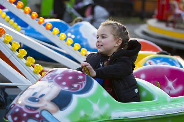 Isabella Frain enjoying a fairground ride at the Heckmondwike Christmas lights switch on event.