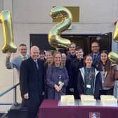 Pupils and staff at Heckmondwike Grammar celebrated the anniversary with a cake cutting ceremony.