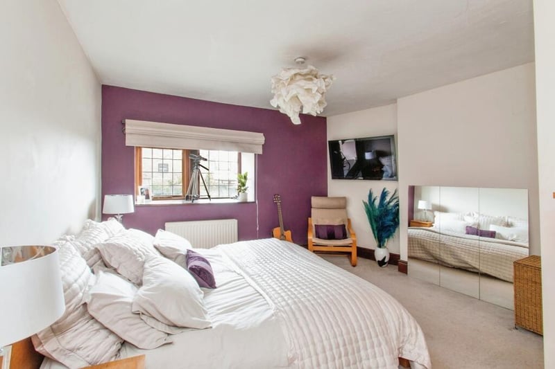 A spacious and bright double bedroom.