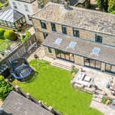 An aerial view of the stunning cottage property and its garden facilities.