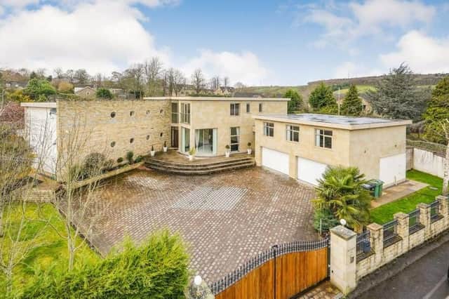 The £2m property has well screened gardens with electric gates giving entry to the driveway.