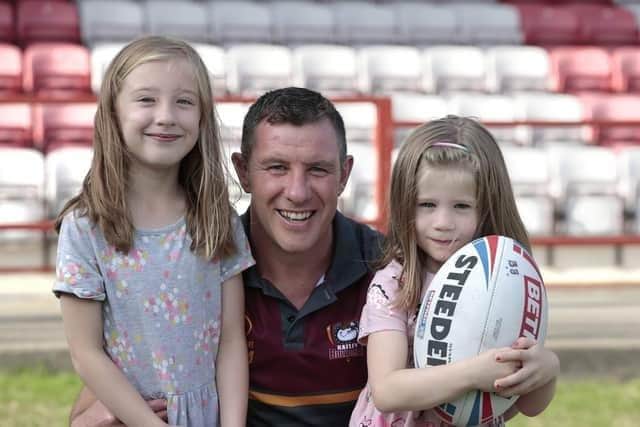 New Batley Bulldogs' head coach Mark Moxon with his daughters Isabella, left, and Pippa, right. Photo: Neville Wright