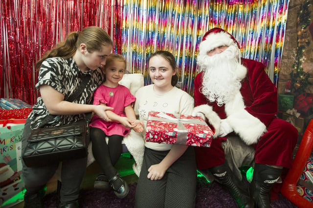 In Santa's Grotto, from the left, Sophie Shepley, 15, Lucie Shepley, five, and Katie Shepley, 12.
