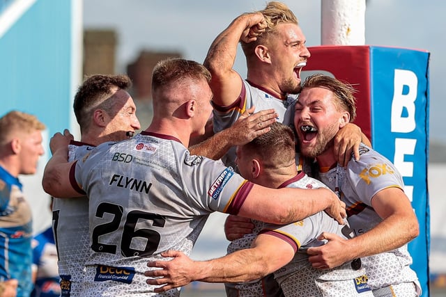 Batley players Tom Gilmore, Nyle Flynn, Luke Hooley, Alistair Leak and Jimmy Meadows celebrate after the play-offs victory at Barrow. Picture: Neville Wright