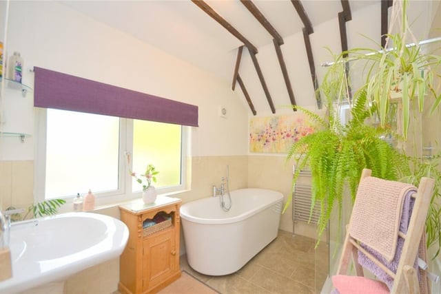 The family bathroom, with free standing bath and double shower.