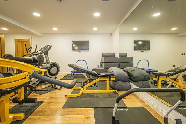 The sizeable home gym is another lower ground floor facility, with a changing room, sauna, and bathroom.