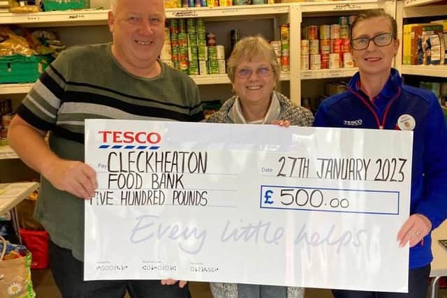 Stephen Archer and Dilys Beaumont, volunteers at Cleckheaton Food Bank, received a cheque for £500 from Melanie Smiles, community champion at Cleckheaton in Tesco