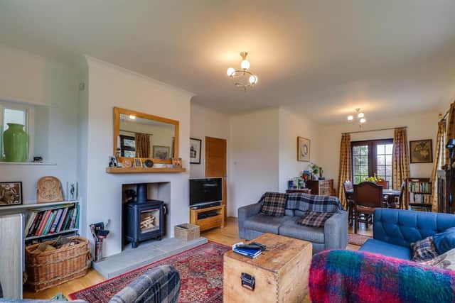 The spacious lounge and diner, with feature fireplace and log burner.
