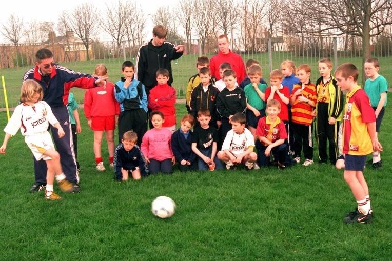 Pupils of Hilltop Primary School receiving expert soccer tuition from Niel Cairns, Ian Ormondroyd and Glenn Conway, Bradford City Community coaches.