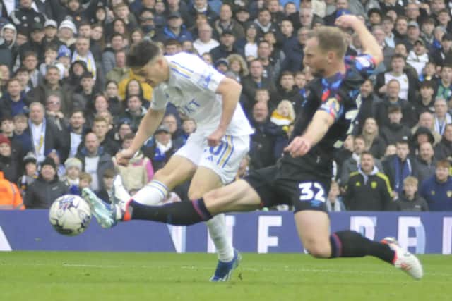 Dan James scores one of his two goals for Leeds United against Huddersfield Town.