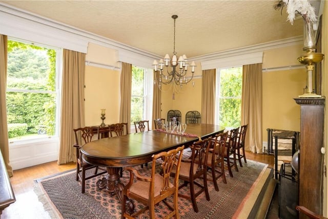 The dual aspect dining room comes with two original tapestries.