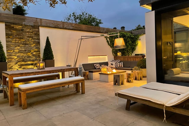 This Mediterranean style courtyard with feature lighting, and south-facing, makes a perfect entertaining spot.
