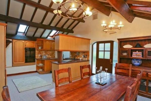 An attractive arrangement linking dining area to kitchen