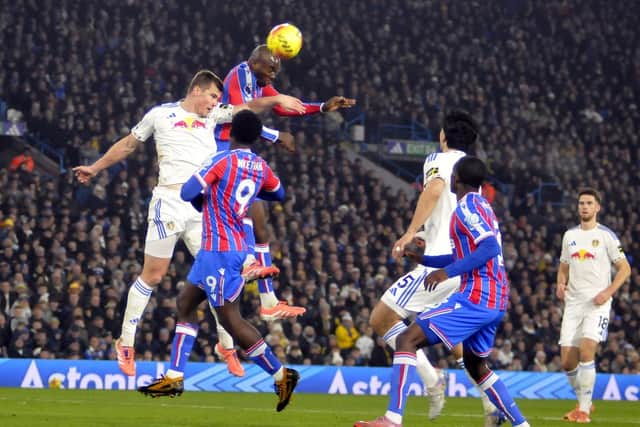 Jaka Bijol, who ended up with two goal assists, makes an aerial challenge against Crystal Palace.