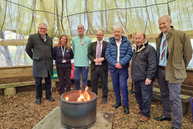 The outdoor learning space was opened by Huddersfield Town ambassador Andy Booth (third from left) and was funded by Wooden Spoon (Yorkshire chairman Stuart Watson, far left). Ravenshall headteacher Rik Robinson, centre, says it will have "a massive impact" on the school's children, while Mark Eastwood MP,  third from right, said it was "an unbelievable" resource.