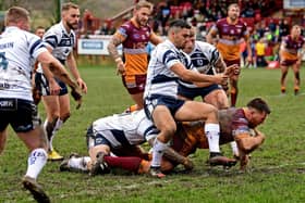 Luke Cooper goes over for a try in Batley's 15-14 1895 Cup group stage win over Featherstone Rovers last month. Photo by Paul Butterfield.