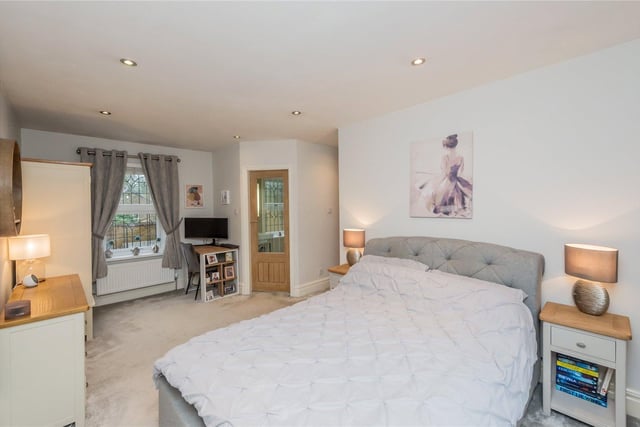 This spacious double bedroom is one of three in the property.