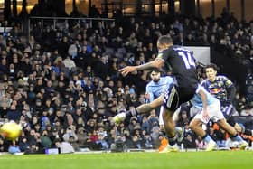 Lukas Nmecha strikes his penalty at Manchester City that was to be saved before he netted from the rebound.
