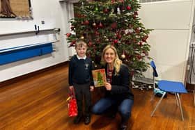 Five-year-old Harlen, a pupil at St Peter’s School, in Birstall, is congratulated by Batley and Spen MP Kim Leadbeater after winning her Christmas card competition.