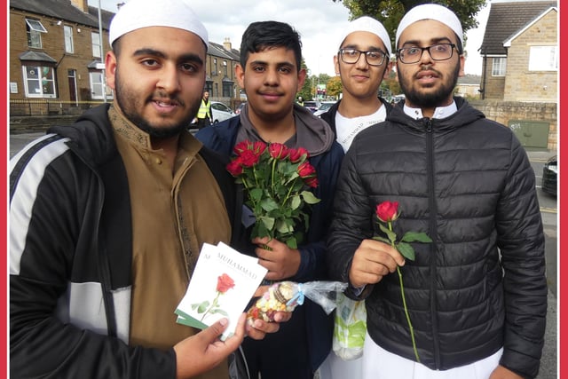 Maddrassah pupils from the Gulzar-E-Madina Jamia Mosque and the Mohaddis-E-Azam Mission - Madani Mosque, at the Dewsbury Eid-Milad Peace Procession giving away free roses.