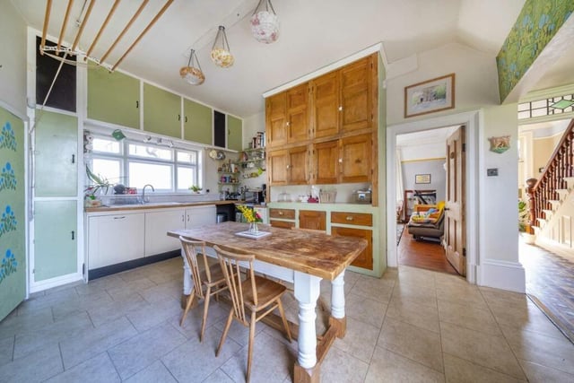The kitchen has ample space for a larger style dining table and chairs.