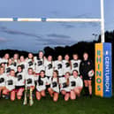 England Internationals Caitlin Beevers (left) and Georgia Roche pose for a photo with Dewsbury Moor players and the Super League Trophy during the Rugby Football League Three Lions Week. Picture: Will Palmer/SWpix.com