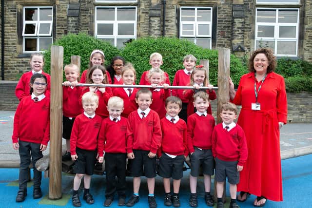 Pupils at Littletown Junior School celebrate the recent Ofsted report with Headteacher Fiona Cullivan-Ward.