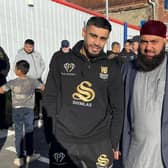 Local boxer Amaar Akbar, left, with Aftab Muaudden, Imam at Jamia Muhammadia Ghausia mosque. The open workout helped to raise nearly £7,000 for the flood victims in Pakistan.