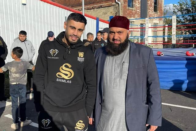 Local boxer Amaar Akbar, left, with Aftab Muaudden, Imam at Jamia Muhammadia Ghausia mosque. The open workout helped to raise nearly £7,000 for the flood victims in Pakistan.