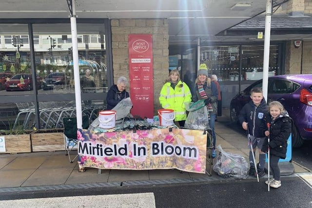 Kim pictured with volunteers from Mirfield In Bloom.