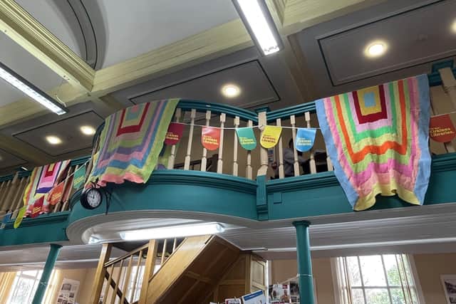 The four knitted blankets on display at Batley Library.