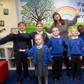 Fieldhead Primary Academy headteacher Donna Popek and a group of pupils celebrate the school's recent Ofsted report.