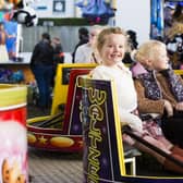 Nora Webster, five, and Edie Webster, six, enjoying the fair rides.