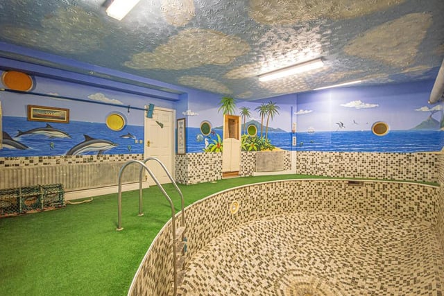 The swimming pool, complete with mural, forms part of the leisure complex with sauna, gym and showers.