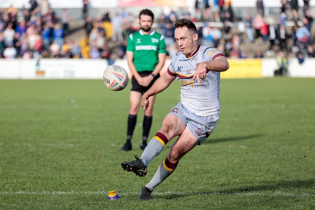 Tom Gilmore kicks one of his three goals for Batley Bulldogs at Barrow. Picture: Neville Wright