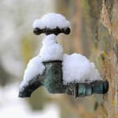An exterior tap covered in snow.  (Photo by Michael Regan/Getty Images)