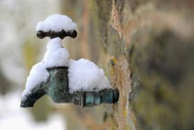 An exterior tap covered in snow.  (Photo by Michael Regan/Getty Images)