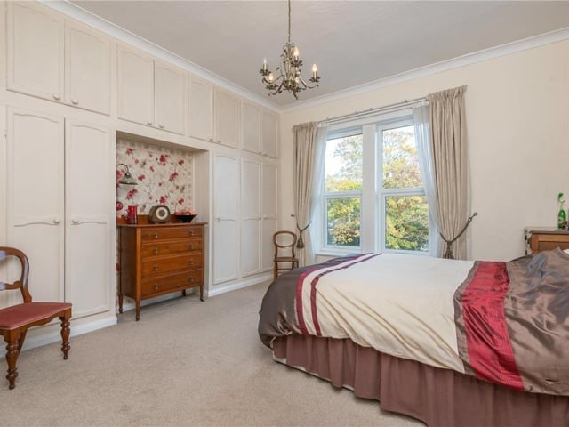 This double bedroom with fitted wardrobes has garden views.