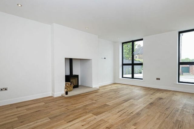 A feature wood burning stove is in situ in the front lounge.