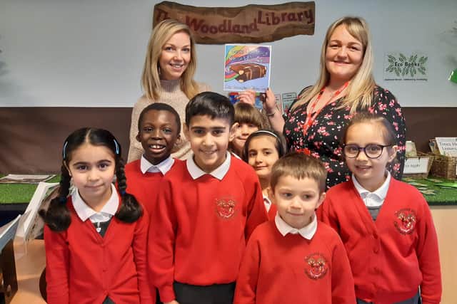 Headteacher Sally Titherington, back left, with deputy headteacher Rebecca Price, and children from Diamond Wood Community Academy.