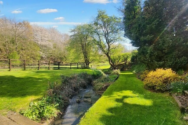 This pretty stream traverses the garden of the property.