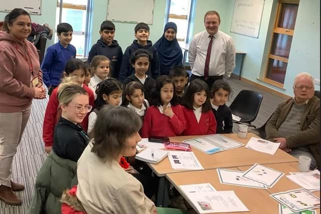 Pupils from Diamond Wood Community Academy at Ravensthorpe in Bloom's AGM where they displayed their artwork to members and informed about how plans were progressing for them to adopt planters in Huddersfield Road, where they will be looking to grow their own plants.